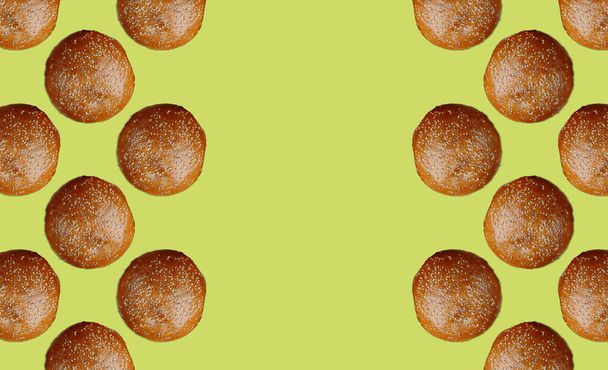 pattern with framed burger buns on a yellow background. High quality photo - Photo, Image