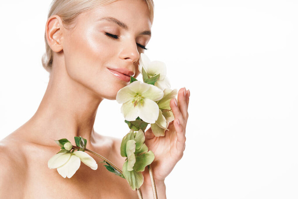 Image of attractive shirtless woman smiling and posing with flower isolated over white background - Φωτογραφία, εικόνα