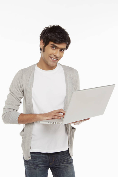 Man using laptop on white background - Photo, Image