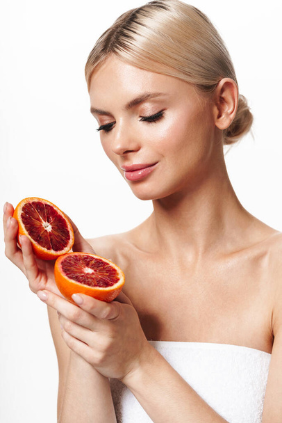 Image of beautiful young shirtless woman posing with red orange isolated over white background - Foto, Imagen