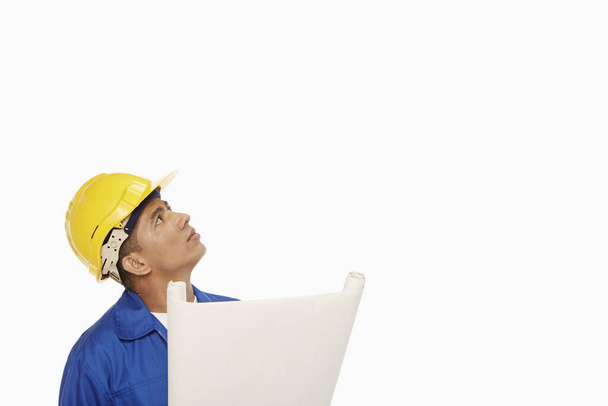 Construction worker looking around - Фото, изображение