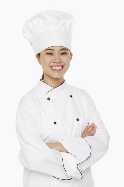 Portrait of a female chef smiling - Foto, Imagen