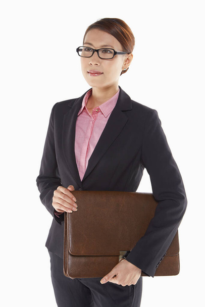 Businesswoman carrying a briefcase - Photo, image