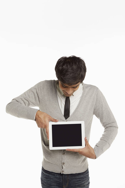 Man holding up a digital tablet - Foto, afbeelding