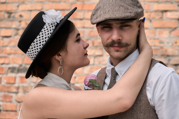 Portrait of a beautiful couple in vintage style. Retro style, classic clothes. - Zdjęcie, obraz