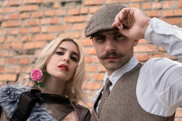 Portrait of a beautiful couple in vintage style. Retro style, classic clothes. - Foto, immagini