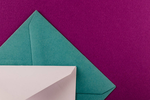 Colorful envelopes on a purple background. Mail envelopes on the table. - Foto, immagini