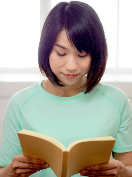young beautiful girl reading a book - Photo, image