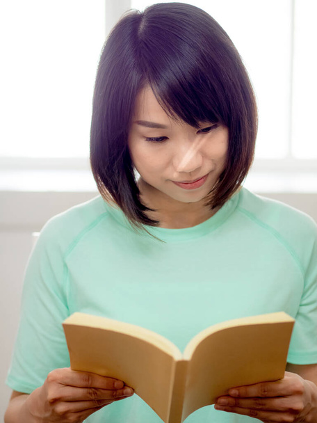 young beautiful girl reading a book - Photo, image