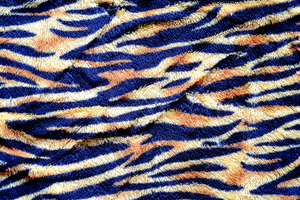 Černý a žlutý tygří pruh na látkovém pozadí - Fotografie, Obrázek
