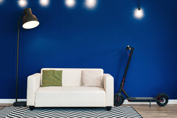 Modern living room interior with white sofa against blue wall - Fotoğraf, Görsel