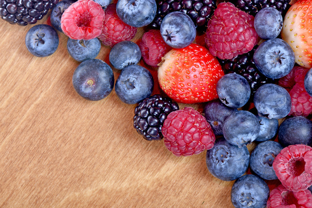 Different fresh berries as background. Top view - Zdjęcie, obraz