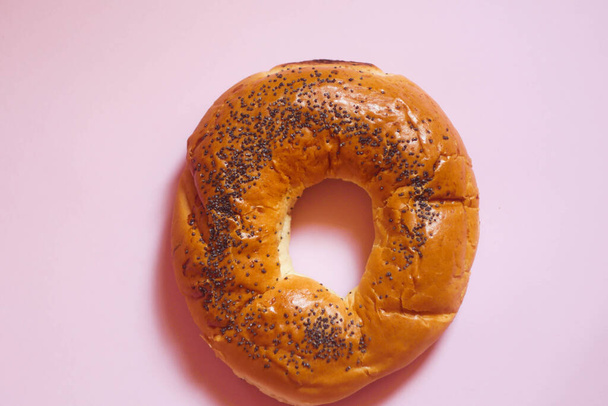 Bagel with poppy seeds. Bakery concept.  - Фото, изображение