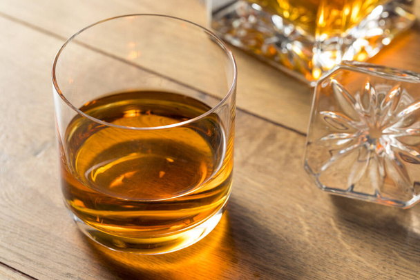 Boozy Alcoholic Whiskey Neat in a Rocks Glass - Фото, изображение