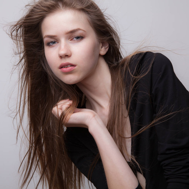 Young beautiful stylish girl posing in studio. - Valokuva, kuva