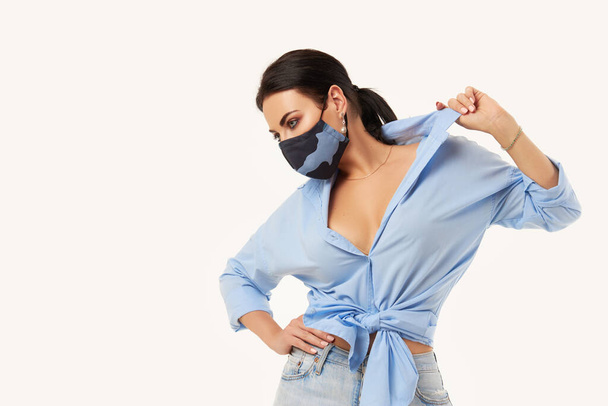 New normal concept. Woman in casual outfit during quarantine of coronavirus outbreak. Model in protective  handmade antiviral face mask on white background	 - Foto, imagen