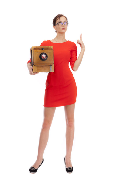 Girl in red dress with an old camera - Foto, Bild