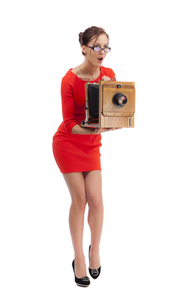 Girl in red dress with an old camera - 写真・画像