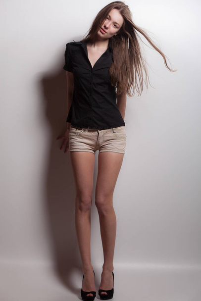 Young beautiful stylish girl posing in studio. - Foto, Bild