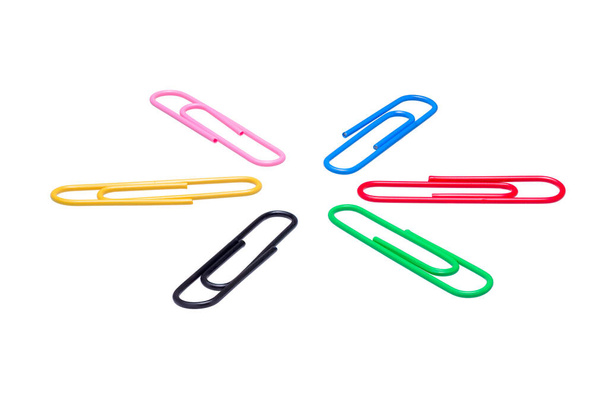 Highly detailed view of a circular arrangement of multicolored paper clips isolated on a white background - Photo, Image