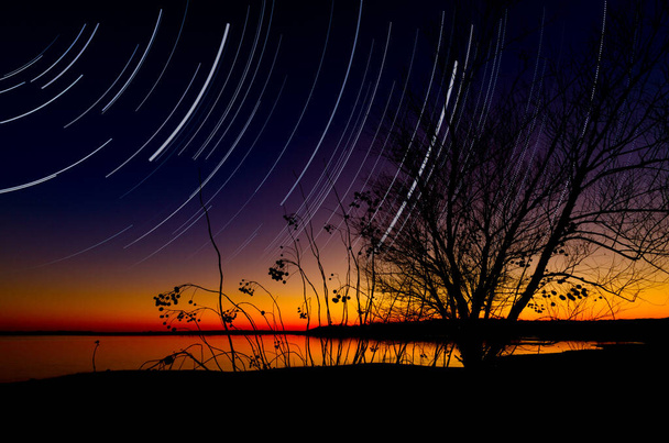 Star trails over Benbrook Lake in North Texas - Photo, Image