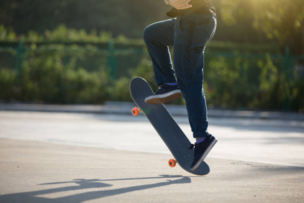 Skateboarder skateboarding at morning outdoors in the parking lot - Photo, Image