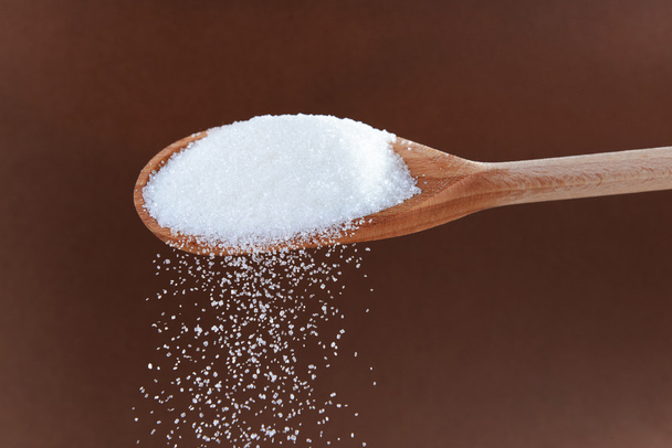 Açúcar sobre fundo castanho
 - Foto, Imagem