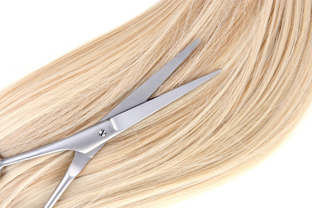 Long blond hair and scissors close up - Foto, immagini