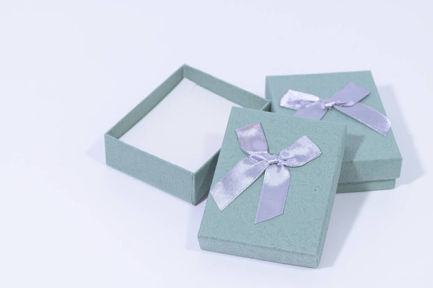 Blue-green gift box In the white background - Foto, imagen