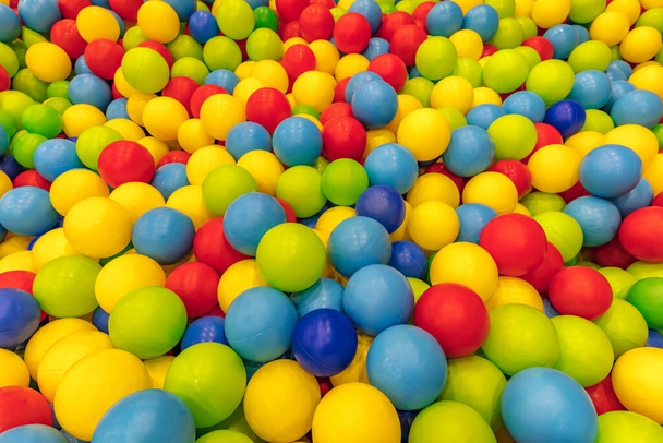 colorful background with multicolored balls in the playground pool - Фото, изображение