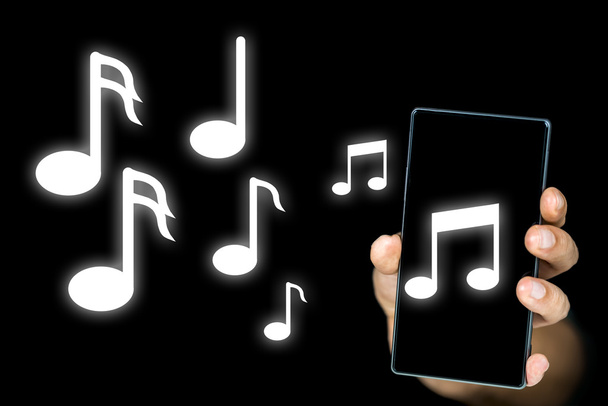 Muziek notities afgifte van een mp3-speler of mobiele - Foto, afbeelding