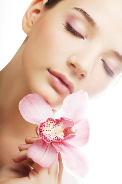 Young woman with pink orchid - Foto, Imagem