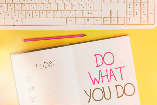 Writing note showing Do What You Do. Business photo showcasing can make things he wants to accomplish Achiever Doer Copy space on notebook above yellow background with keyboard on table. - Foto, imagen