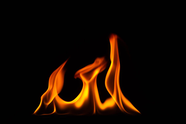Close-up shot of a black background flame - Photo, Image