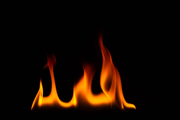 Close-up shot of a black background flame - Photo, Image