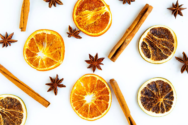 Dried slices citrus and star anise pattern on white background - Zdjęcie, obraz