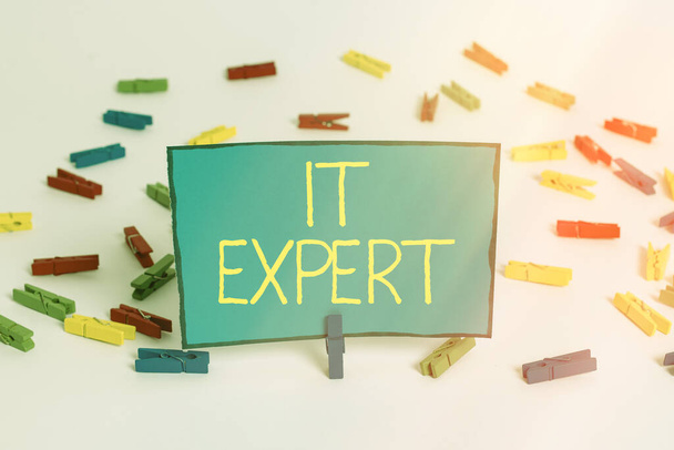 Word writing text It Expert. Business concept for expertise when dealing with database system, and technology Colored clothespin papers empty reminder white floor background office. - Photo, Image