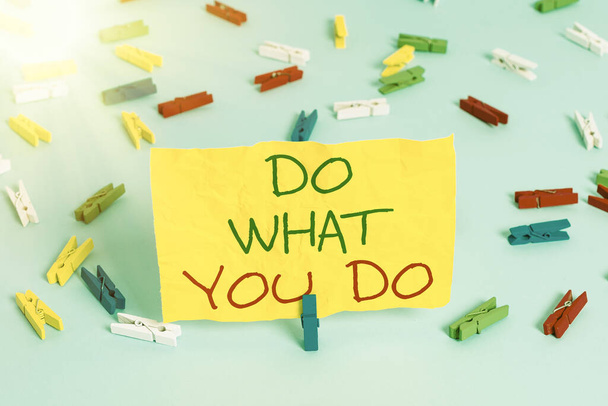 Handwriting text writing Do What You Do. Concept meaning can make things he wants to accomplish Achiever Doer Colored clothespin papers empty reminder blue floor background office pin. - Photo, Image