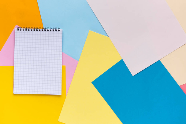 Many colorful empty notepad sheets of paper, flat lay view. - Photo, Image