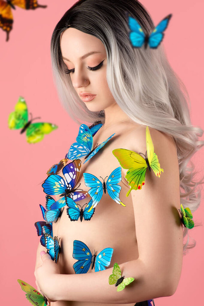 beautiful blonde woman with butterflies - 写真・画像