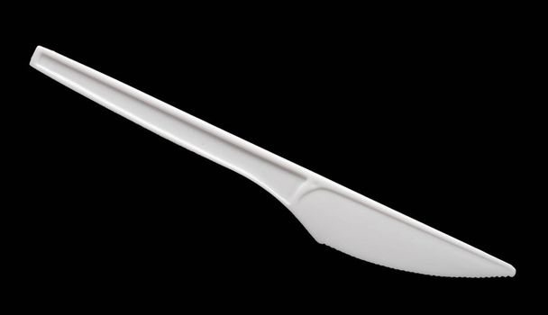 пластиковый нож на черном фоне
 - Фото, изображение