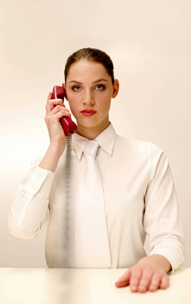Businesswoman answering a phone call - Foto, imagen