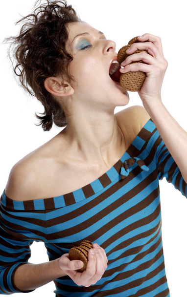 Greedy woman eating biscuits - Fotografie, Obrázek