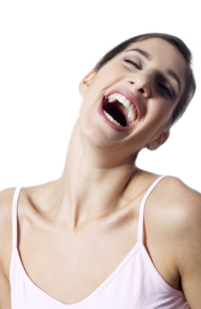 Woman laughing, studio shot - Фото, зображення