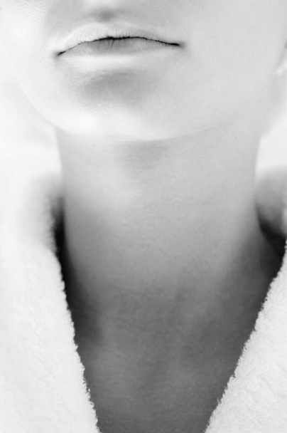Close-up on woman in bathrobe - Foto, afbeelding