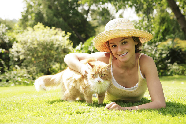 young woman with dog in the park - Photo, Image
