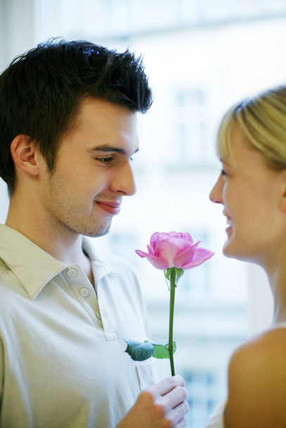 Man giving his wife a flower - Photo, Image