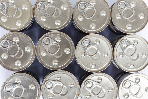 Top view on rows of metal cans with keys. Close-up. - Photo, Image