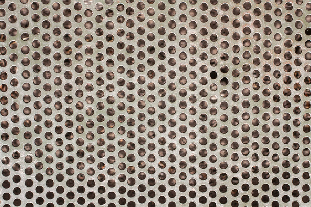 Contexte d'un thème industriel. La texture de surface de la grille métallique avec des trous ronds. - Photo, image