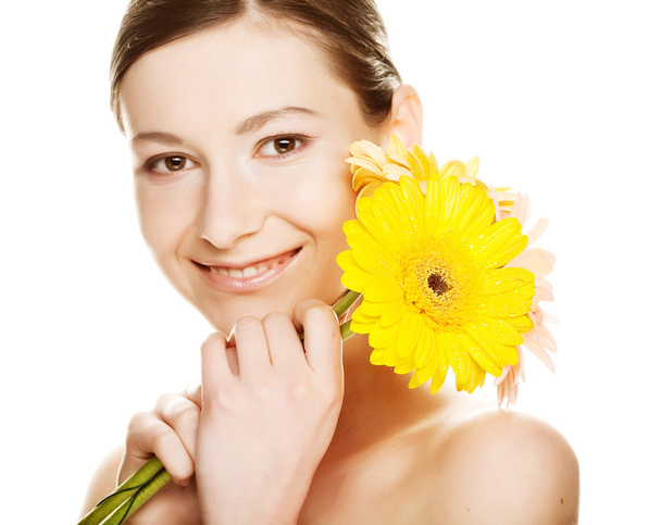 Young woman with gerber flower - Photo, Image